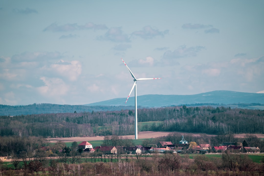 white-wind-turbine-on-green-grass-field-during-daytime-mmtjj8jp-rw